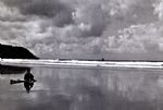 Contemplating the surf by Artist Simon Shaw